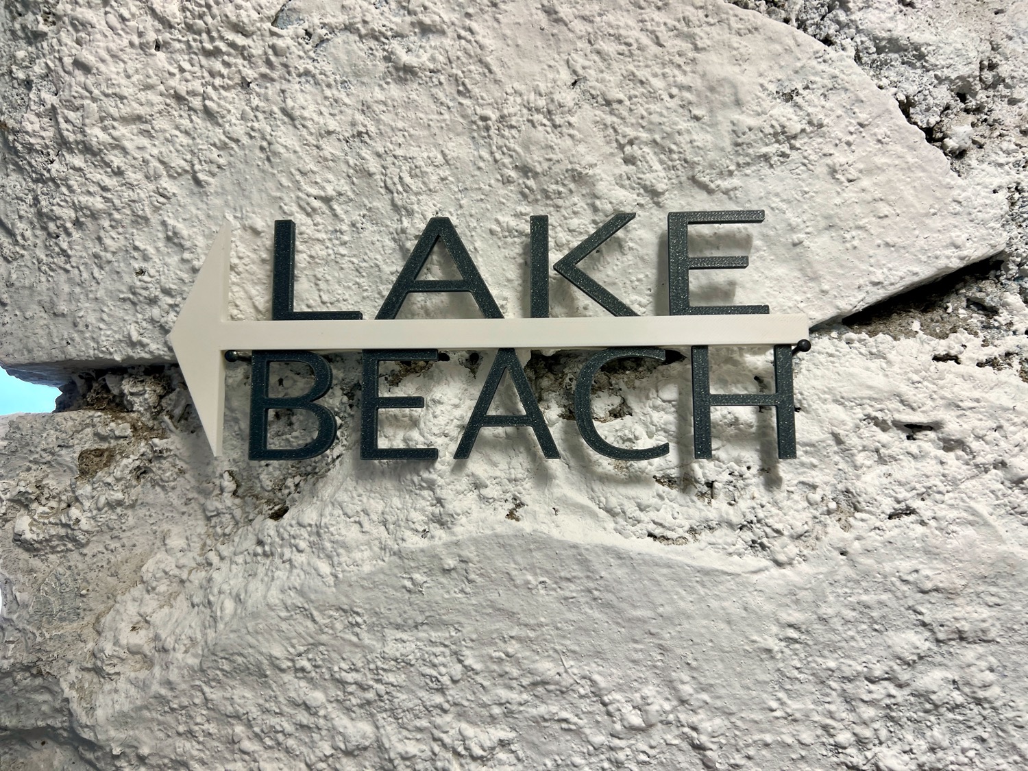 Serene lake beside sandy beach