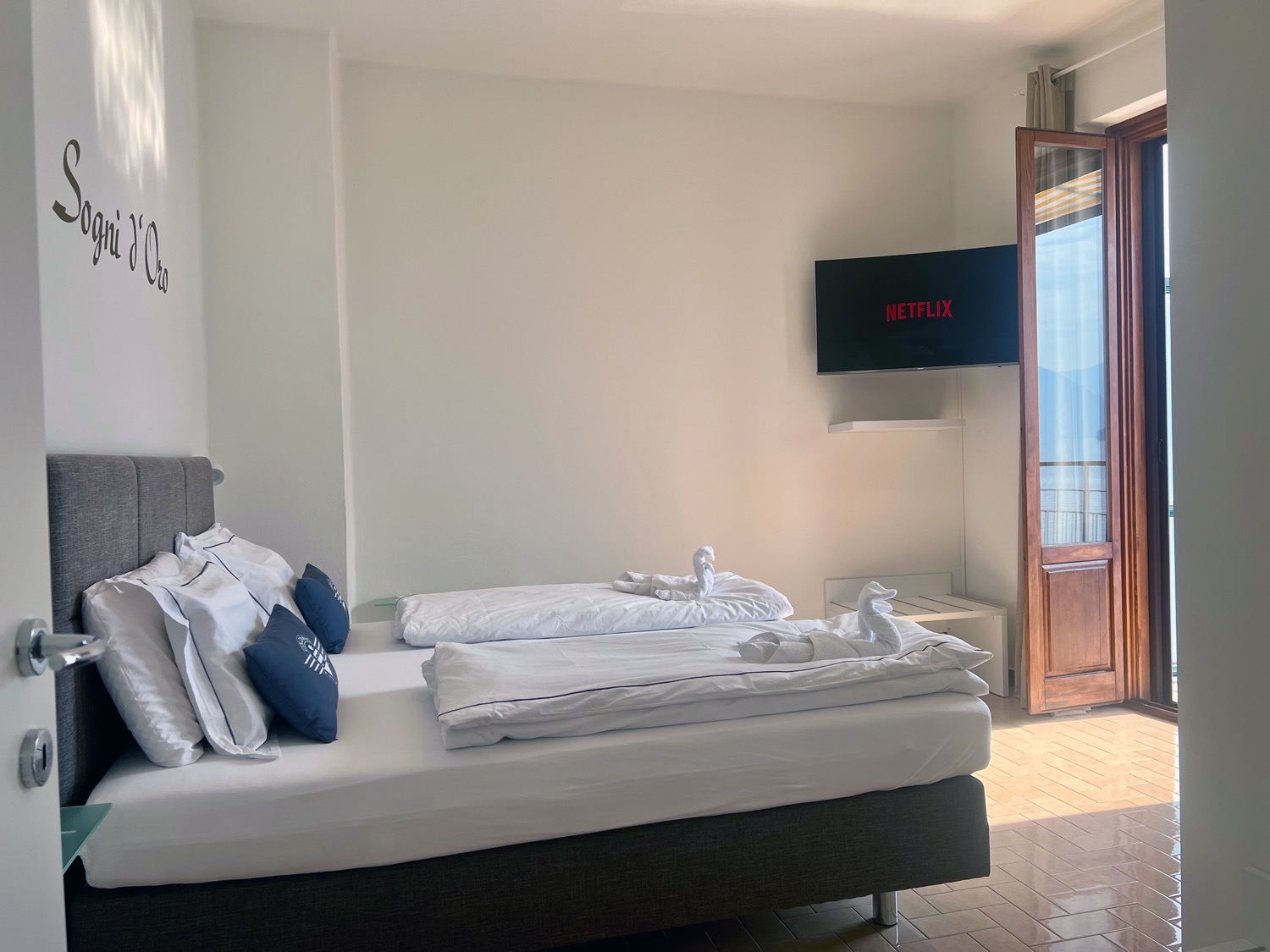 Wooden bedroom with bed and furniture