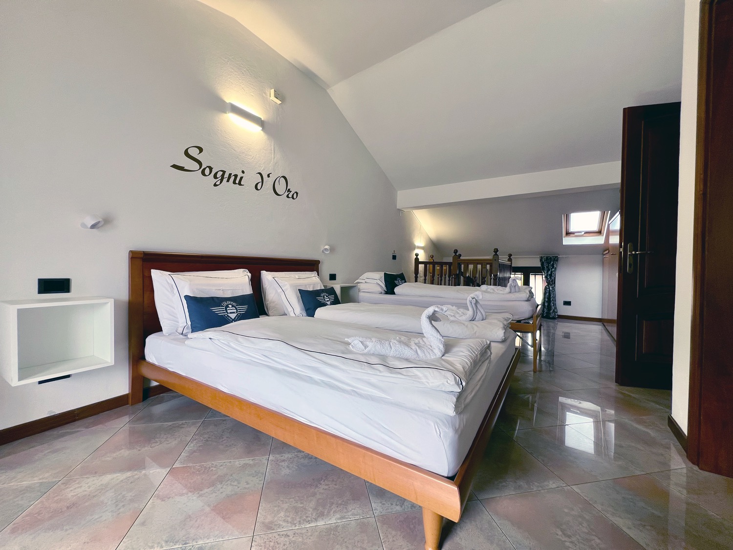 Wooden room with bed and pillows