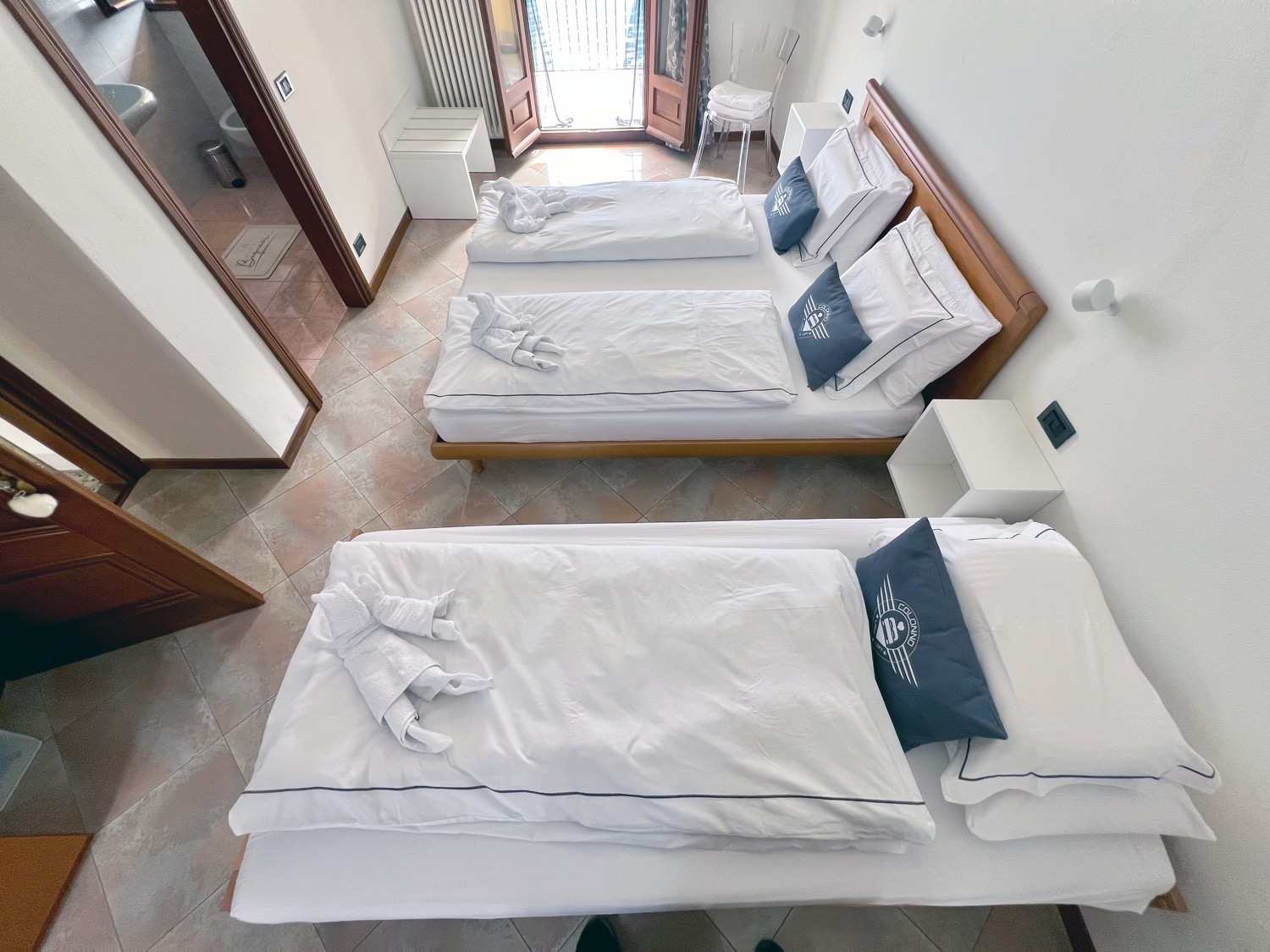 Wooden bedroom with bed and furniture