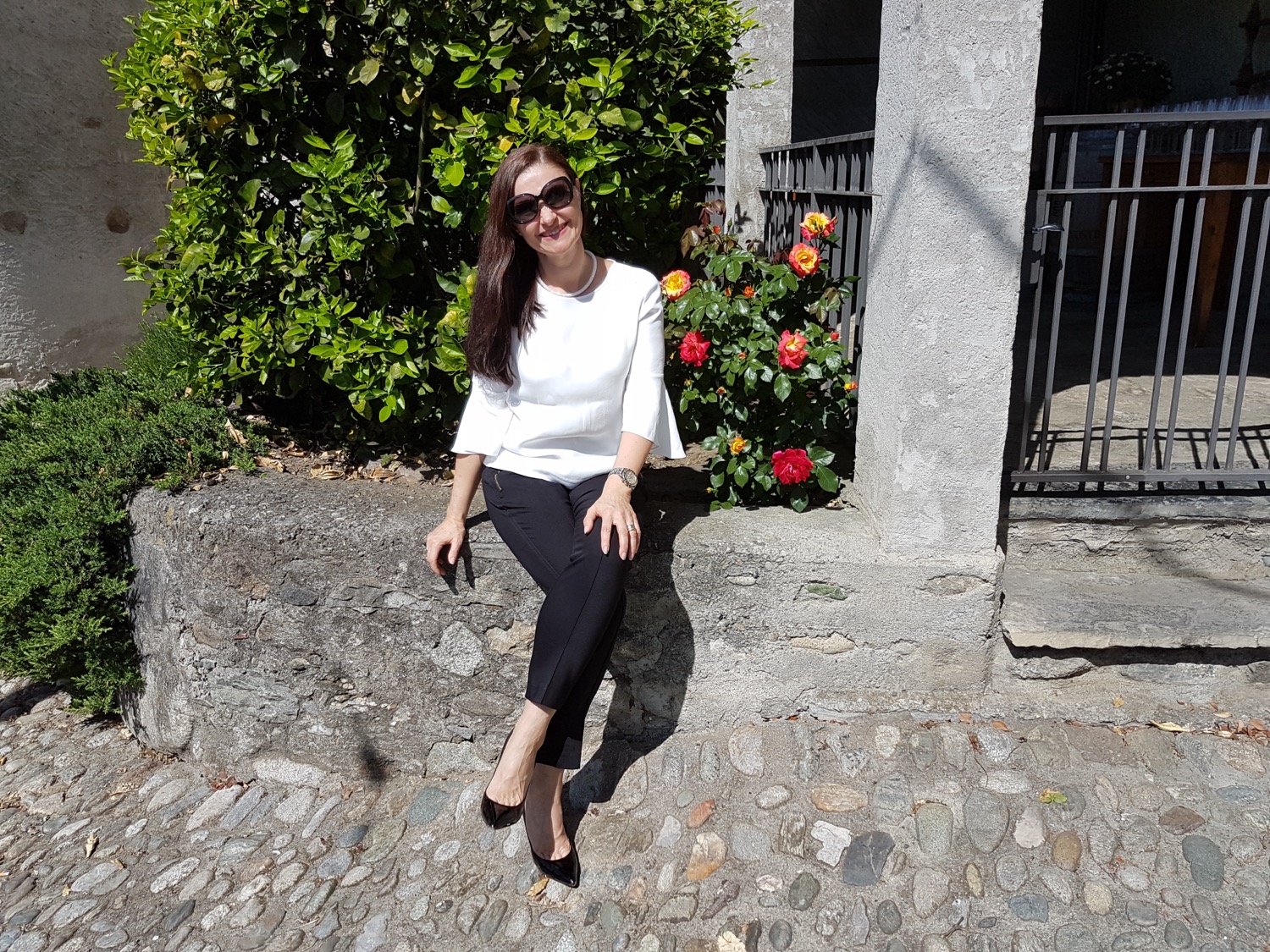 A person in a tent with furniture and a table