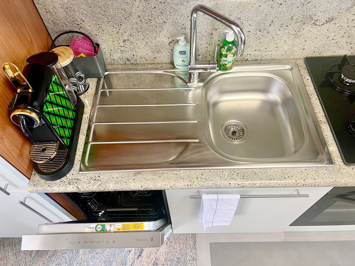 Wooden interior kitchen with cabinetry and sink