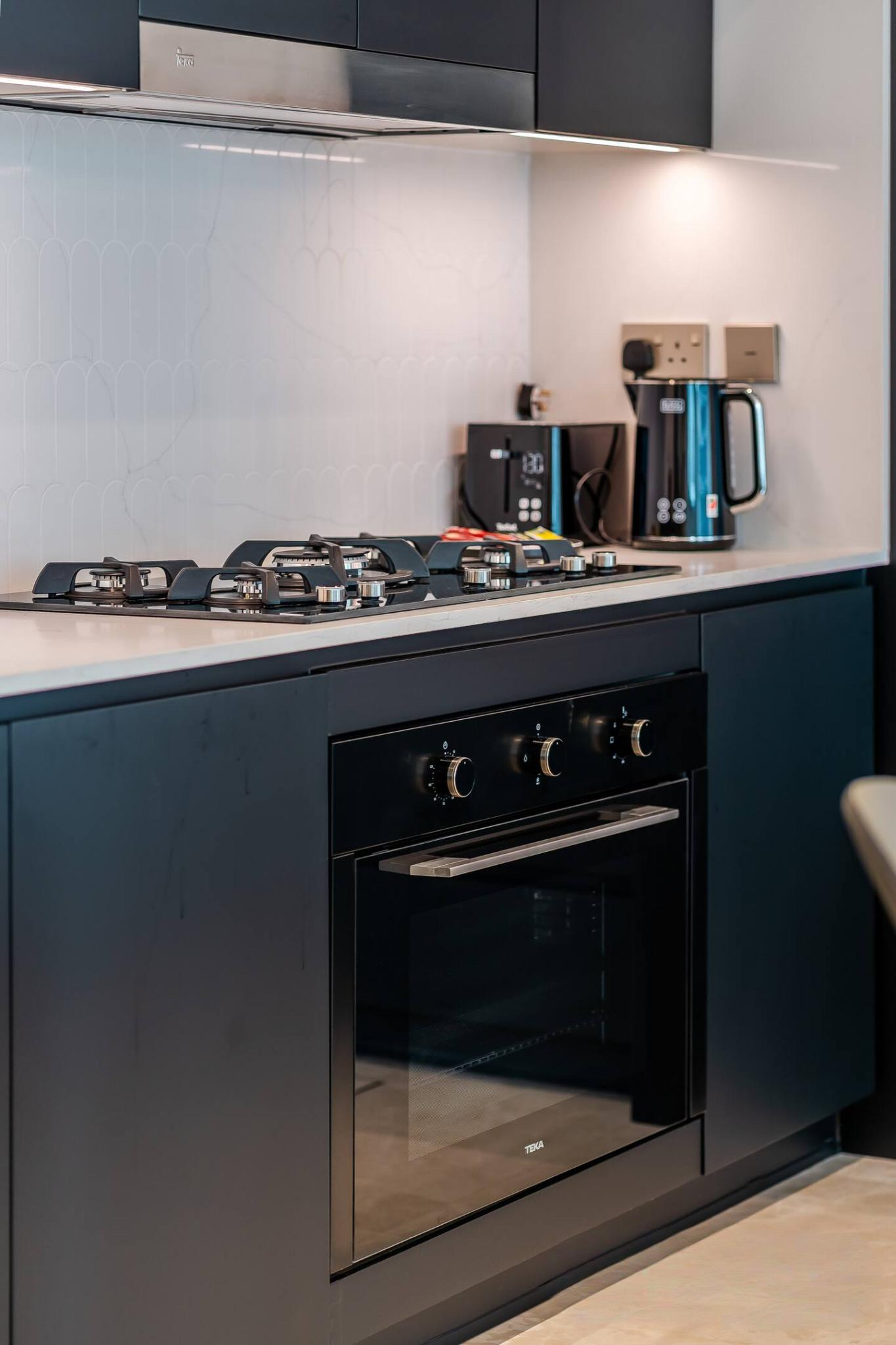 Wooden kitchen with stove and cabinet