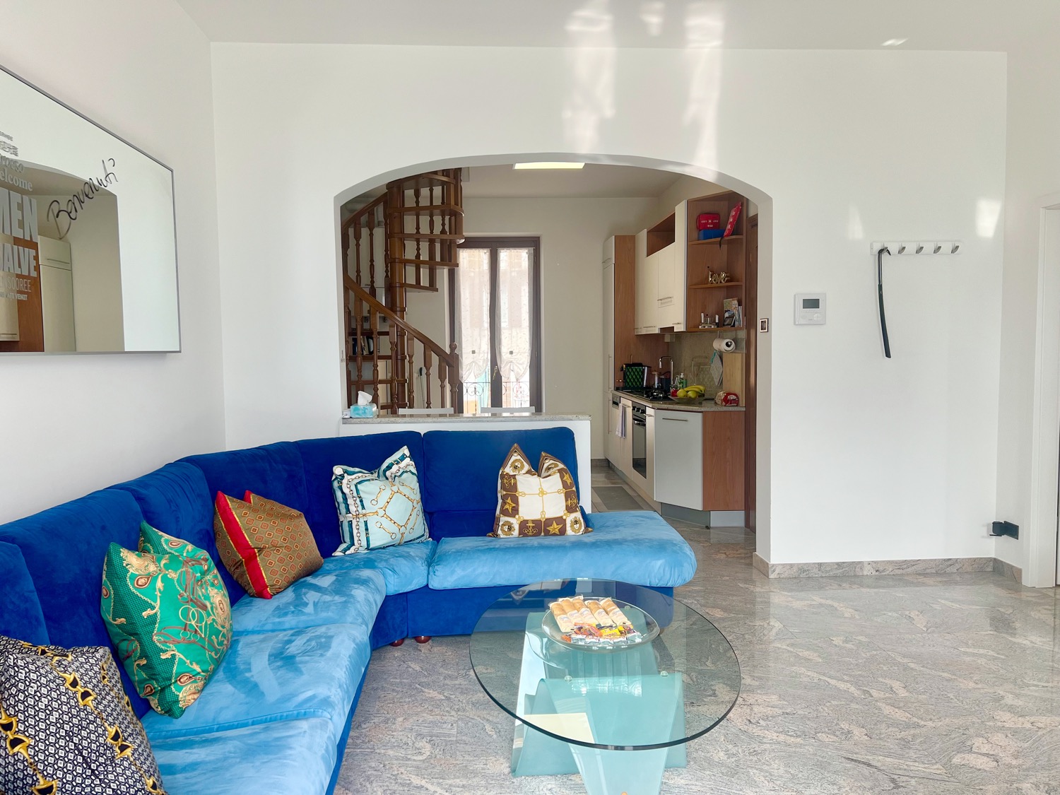 Sofa in room with furniture and door