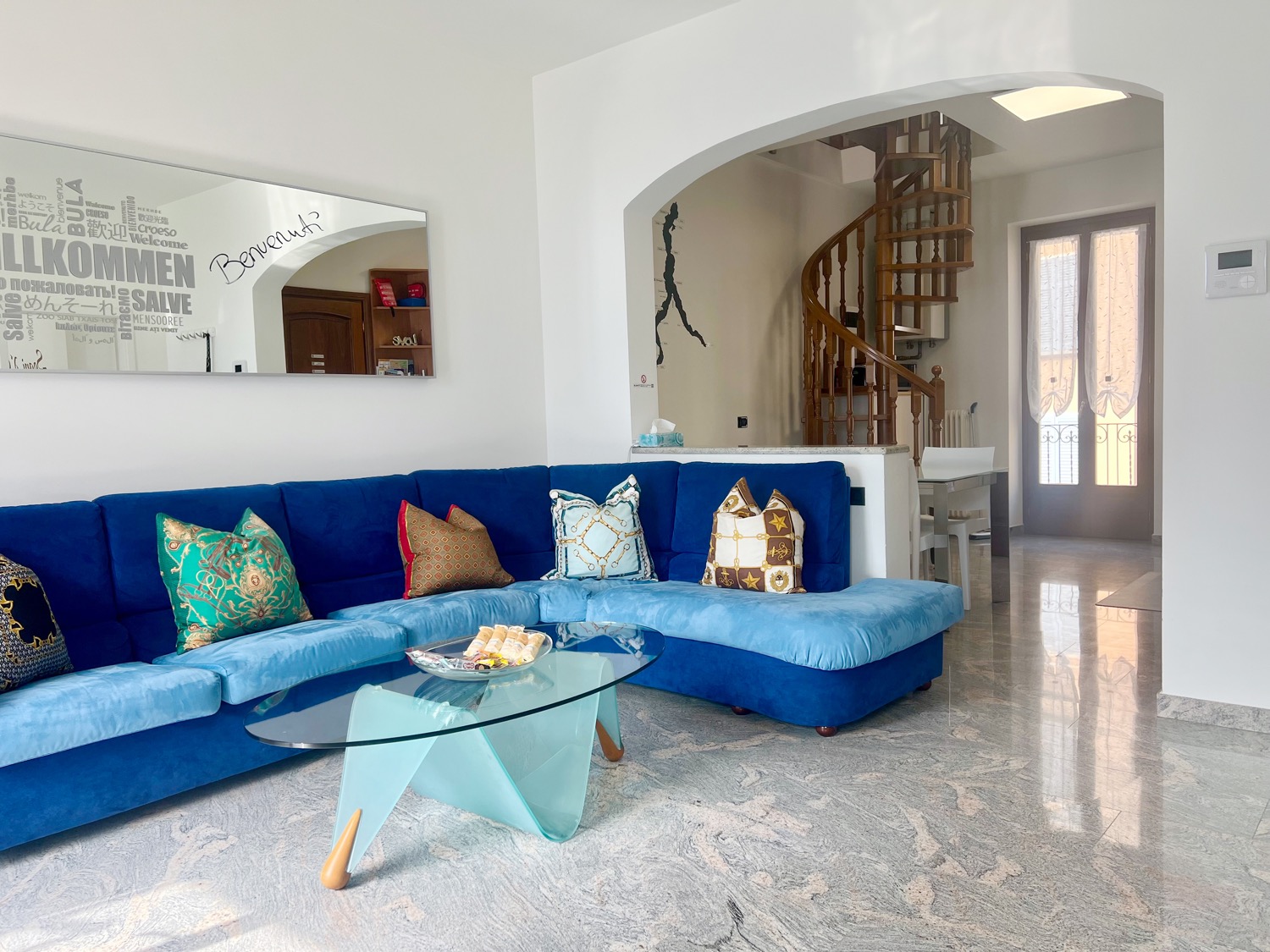 Interior room features sofa and arch