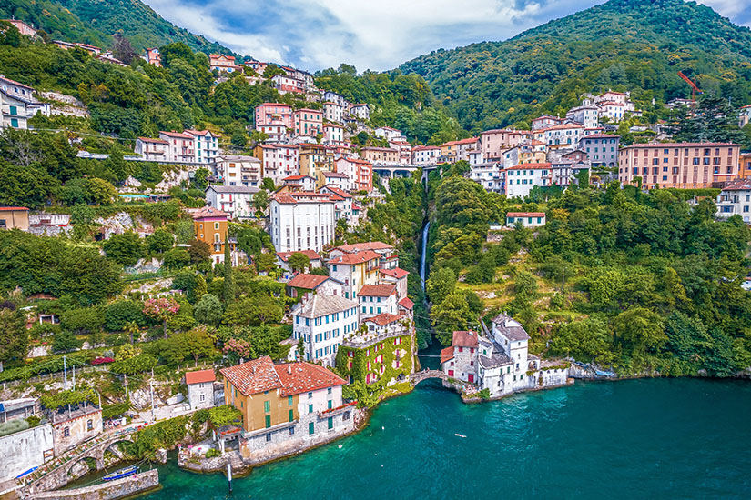Cloudy sky over a hill and lake