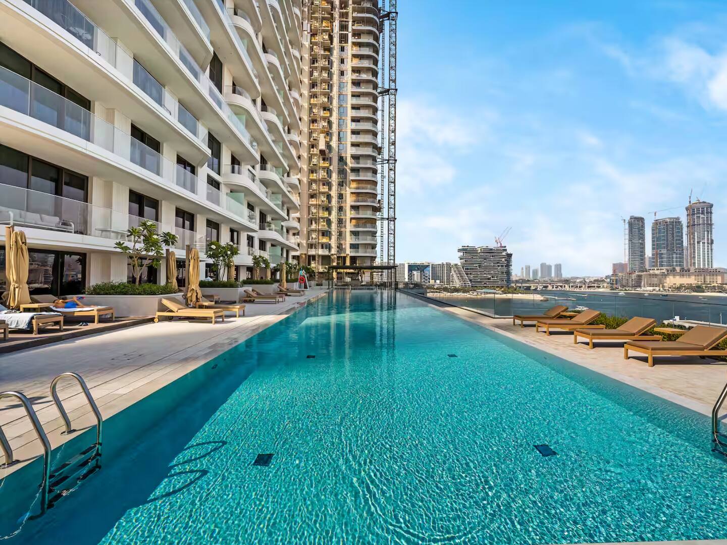 Cloudy pool with blue sky
