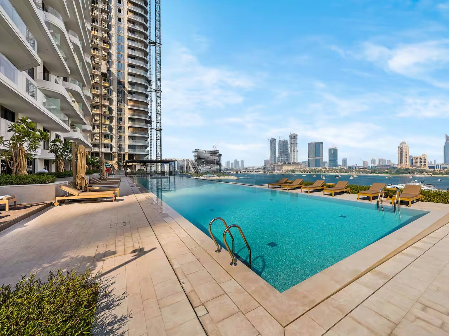 Blue cloudy sky above outdoor pool