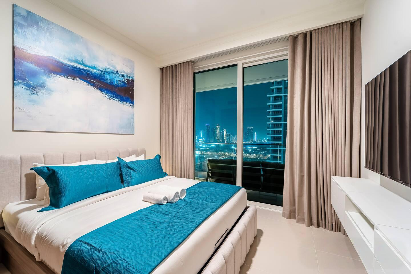 Cozy bedroom with comfortable bed and pillows