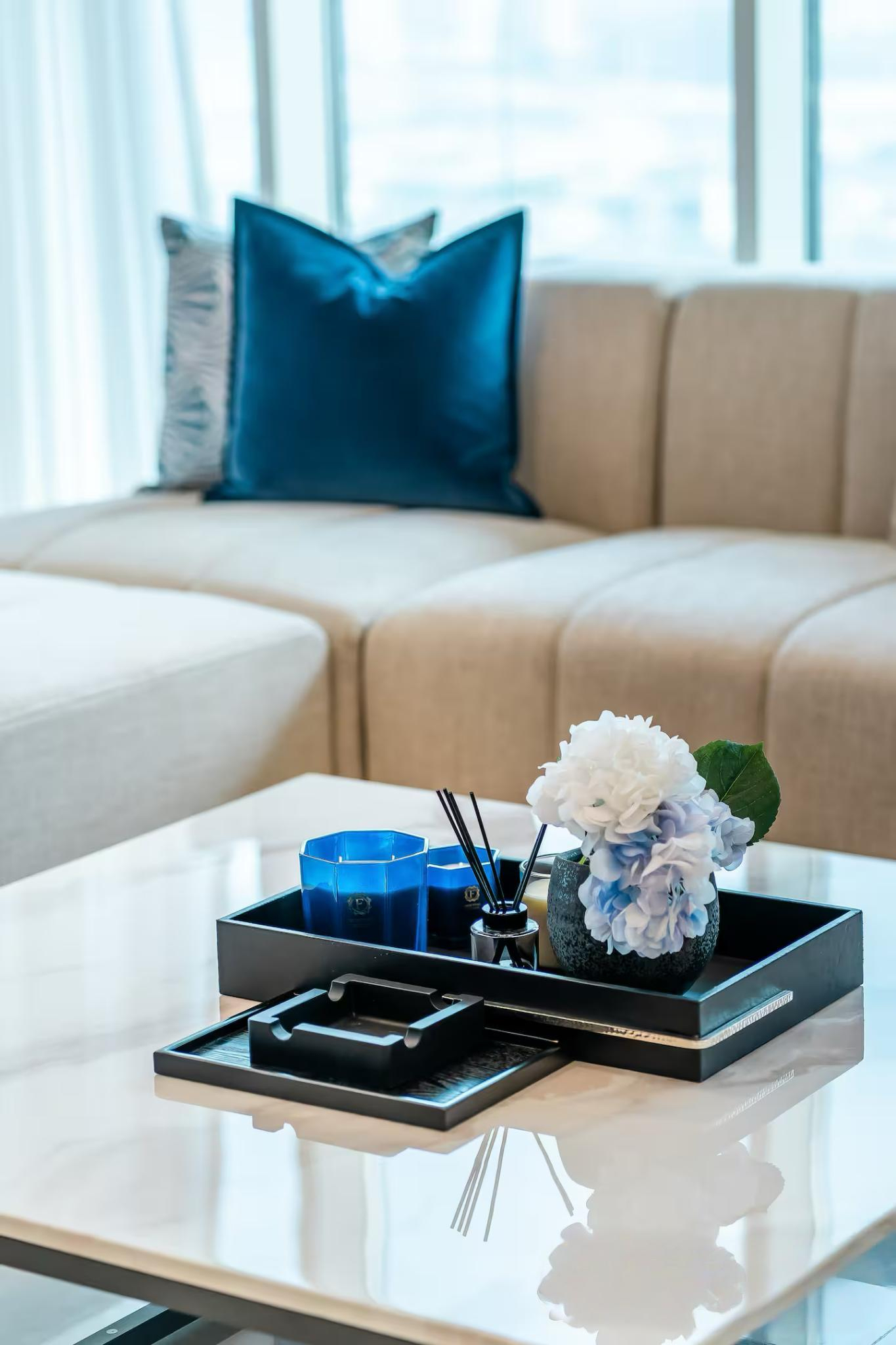 A cozy living room with a stylish sofa and matching furniture