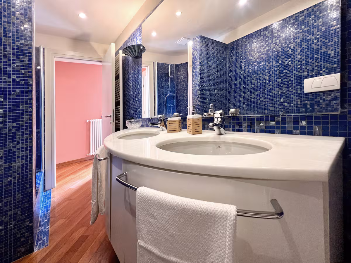 Wooden bathroom interior with washbasin and faucet